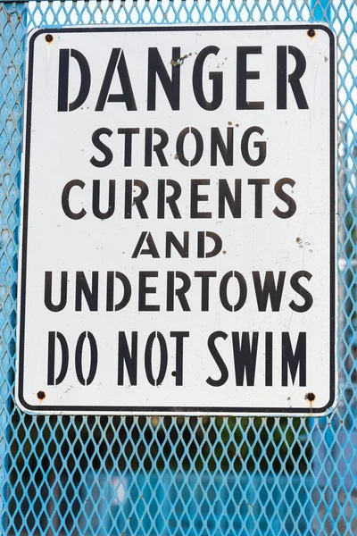 Danger do not swim sign warning of strong currents and undertows