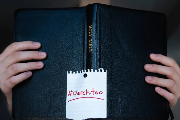 Woman holding Holy Bible with #churchtoo hashtag written on cover — Stock Photo, Image