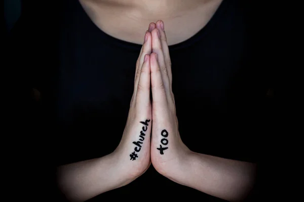 Woman holding hands in prayer with hashtag #churchtoo written on hands. — Stock Photo, Image