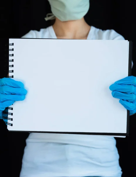 Close Blank Notebook Page Held Woman Wearing Face Mask Surgical Royalty Free Stock Images