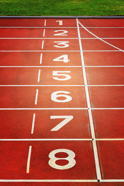 Red running tracks in sport stadium