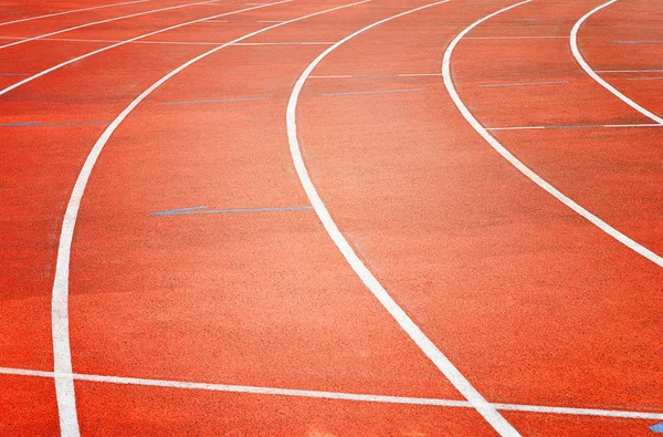 Red running tracks in sport stadium