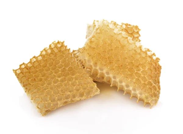 Favo de mel perto de um fundo branco — Fotografia de Stock