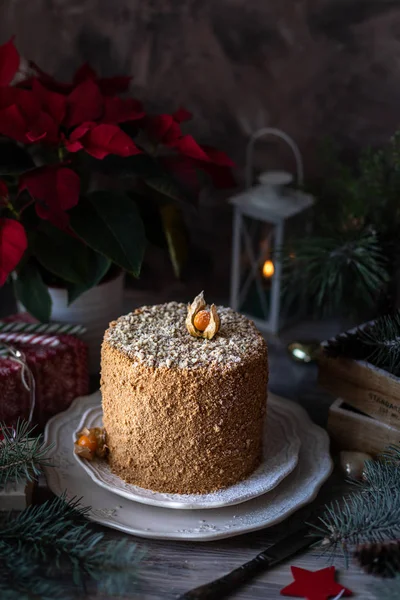 Homemade honey cake. Winter composition. New Year photo. Christmas decoration. Christmas decorations. Cake with sparklers.