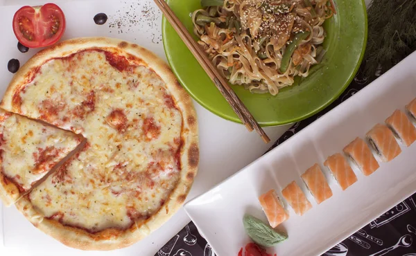 ready meal pizza and rice pasta sushi rolls food photo