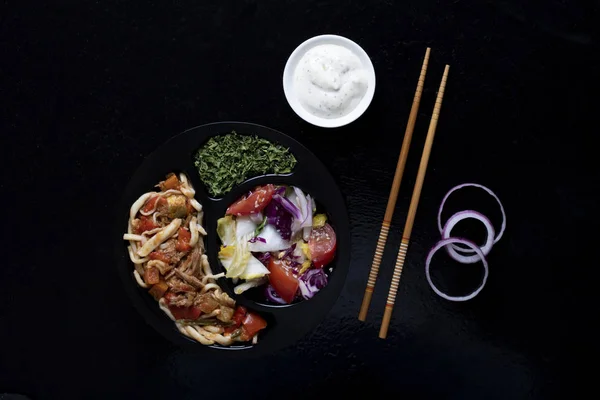 vegan ready meal to eat, asian food with sticks and sauce, top view