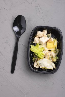 salad with chicken, avocado, spinach and cheese. top view.