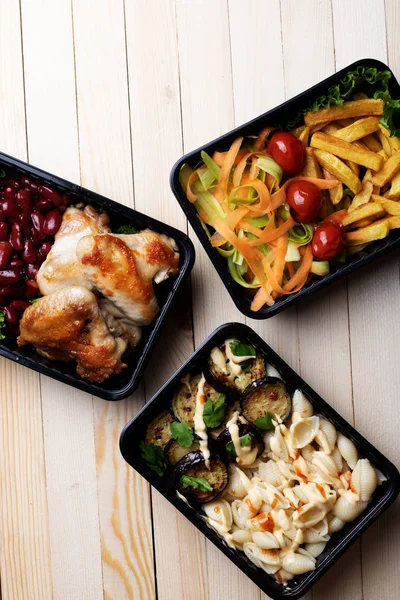 Top View Chicken Legs Beans French Fries Salad Noodles Eggplant — стоковое фото