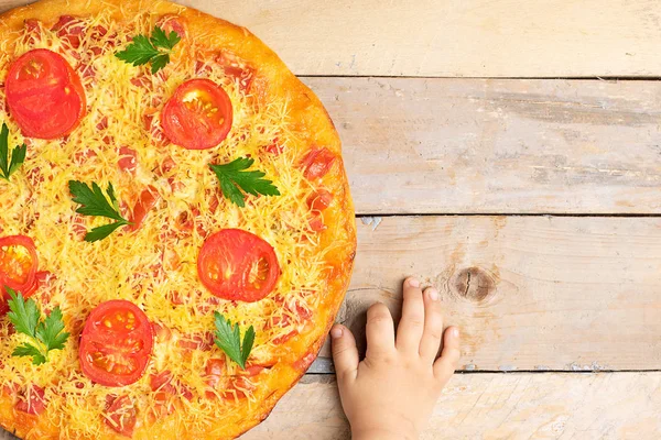 ready meal to eat, fast food with baby hands, cheese pizza with tomatoes