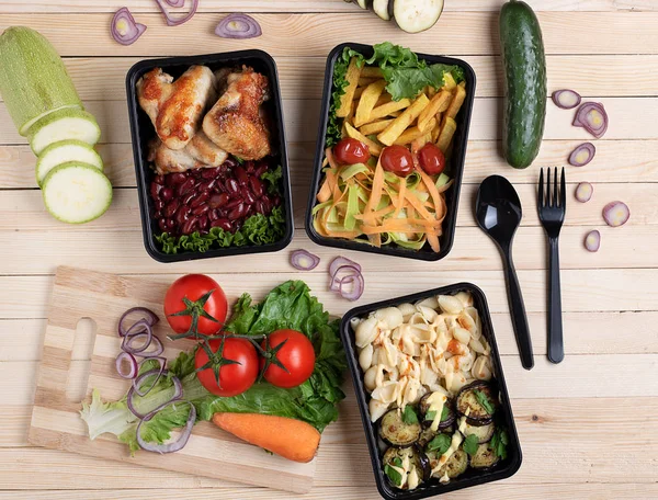 ready meal to eat in food boxes, flat lay. Vegetables background