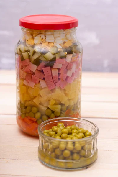 Fresh vegetable salad in jar, pea, corn carrot