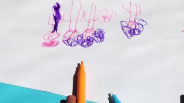 cropped view of kid drawing
