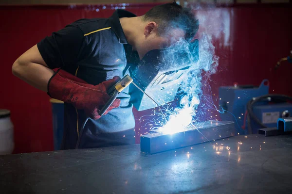 engineering worker with welding machine
