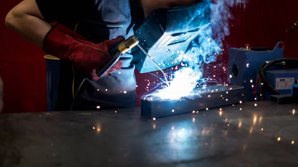 welder worker at work at a metalworking company