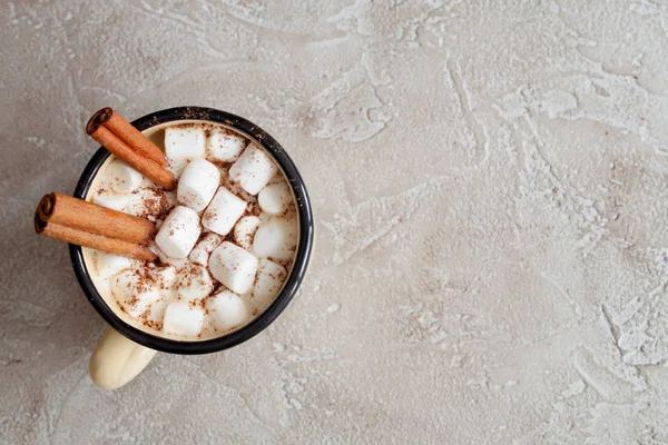 Cup of hot cocoa with marshmallows and cinnamon. Christmas concept.