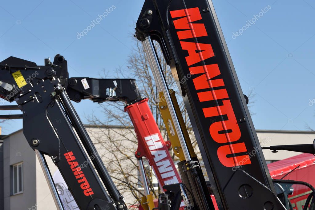 Kaunas, Lithuania - April 04: Manitou forklift tractor detail and logo in Kaunas on April 04, 2019. Manitou is a firm that makes fork lifts, cherry pickers, and other heavy equipment