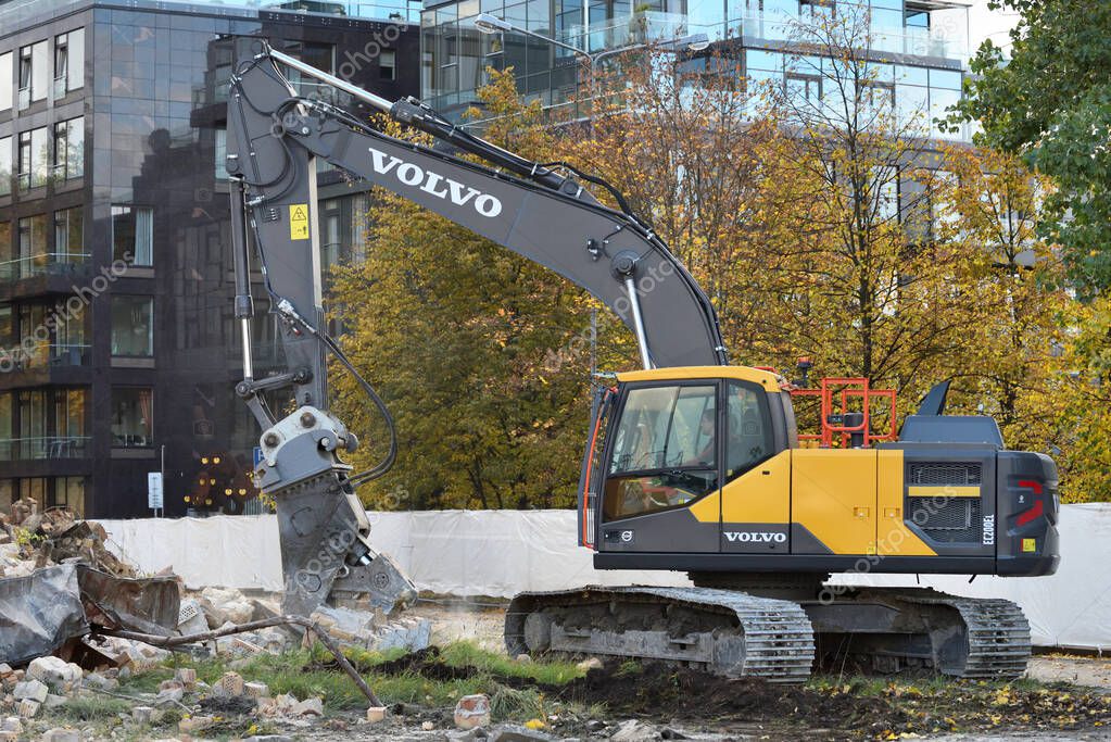 Vilnius, Lithuania - October 09: Volvo excavator works on a construction site in Vilnius Old Town on October 09, 2019 in Vilnius Lithuania.