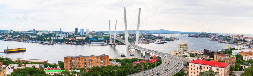 Panoramic view from Eagle's Hill on the Zolotoy Golden Bridge is cable-stayed bridge across the Zolotoy Rog or Golden Horn in Vladivostok, Russia