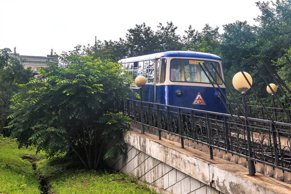 The Blue Car of the Funicular goes down. The attraction of the capital of the Russian Far Easts Vladivostok city.