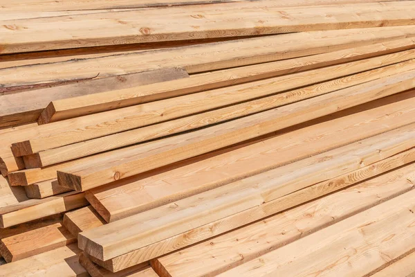 Stack of fresh construction boards or bars.