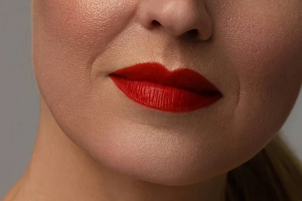 Close-up of full lips of mature woman with wrinkles. anti aging skin care program. Injections and lifting