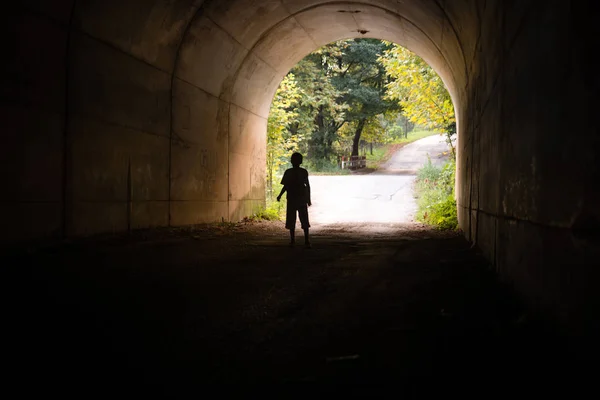 Boy Alone Entering Dark Tunnel — Stock Photo, Image