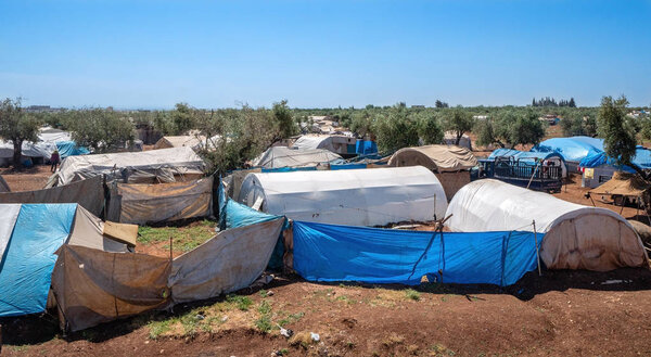 AZEZ, SYRIA - MAY 19: Refugee camp for syrian people in Burseya hill on May 19 2019 in Azez, Syria. In the civil war that began in Syria on 2011 12 million people were displaced.