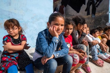 IDLIB, SYRIA  MAY 18: Despairing children in orphan camp of faith on May 18 2019 in Idlib Syria. In the civil war that began in Syria in 2011, 12 million people were displaced. clipart