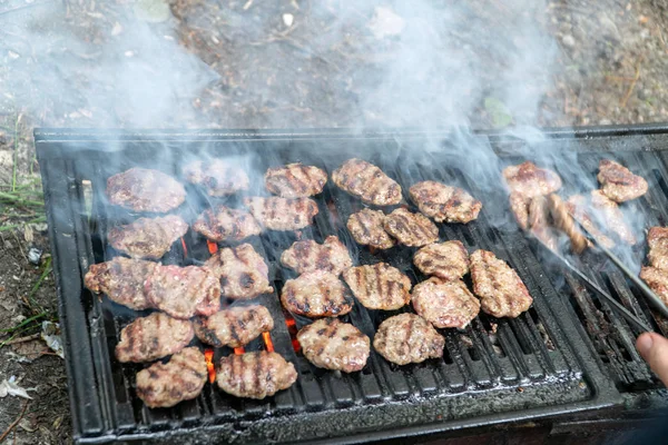 Grilling meatballs on the grill — Stock Photo, Image