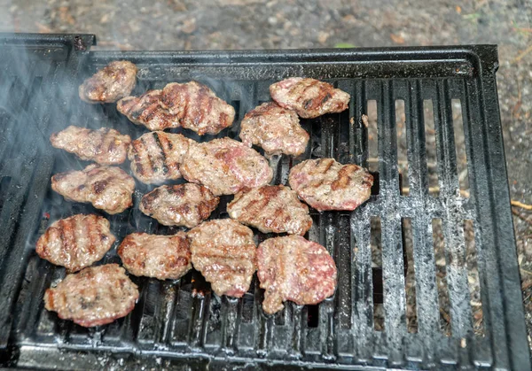 Grilling meatballs on the grill — Stock Photo, Image