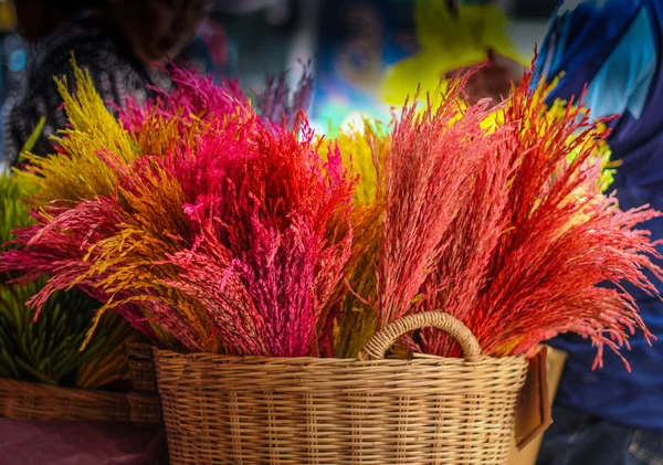Dried colorful flowers in the jute basket