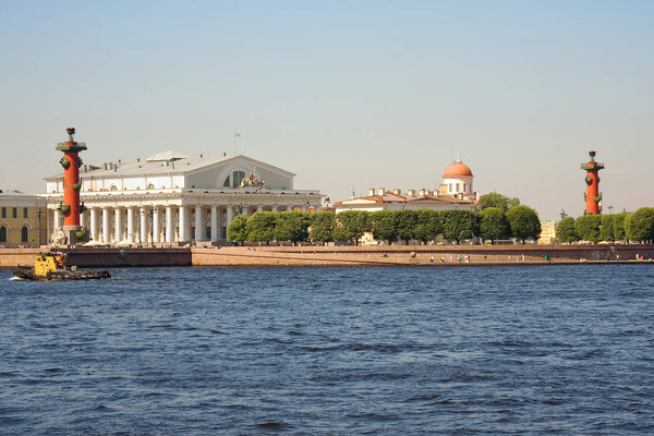 Saint-Petersburg. Russia. Vasilievsky island. Rostral column. The Exchange building on Vasilievsky island is one of the business cards of St. Petersburg.The building looks like an ancient Greek temple, surrounded by 44 columns. Rostral columns were b