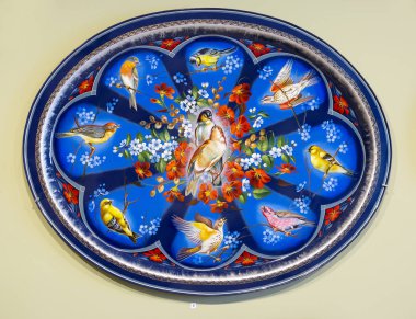 Moscow, Russia, 01/26/2016, Zhostovo painting. This is a Russian folk art craft painting wrought metal (tin) trays, existing since 1825 in the village of Zhostovo, Moscow region.