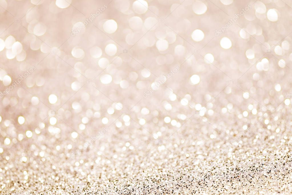 beige champagne white glittering Christmas lights. Blurred abstract background