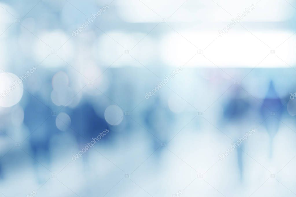abstract defocused blurred empty space technology background with silhouettes of unrecognizable people