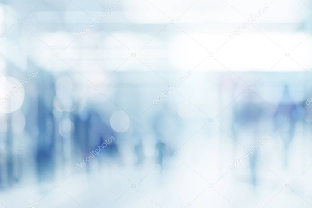 abstract defocused blurred empty space technology background with silhouettes of unrecognizable people