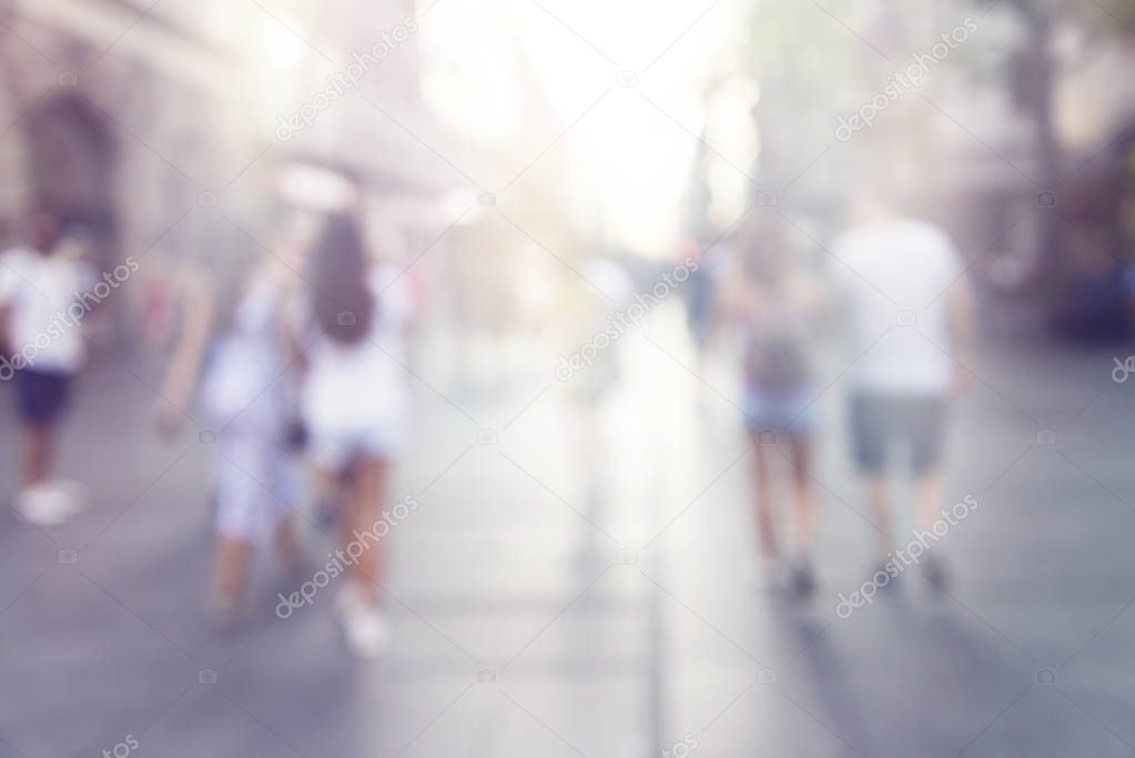 blur abstract people background, unrecognizable silhouettes of people walking on a street