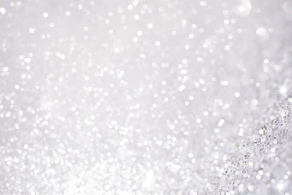 Ezüst fehér csillogó karácsonyi fények. Homályos absztrakt főleg CIG — Stock Fotó
