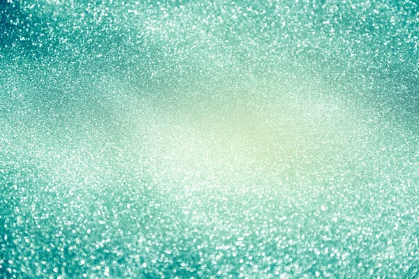 Şenlikli, pırıl pırıl noel ışıkları. Bulanık mavi yeşil arkaplan