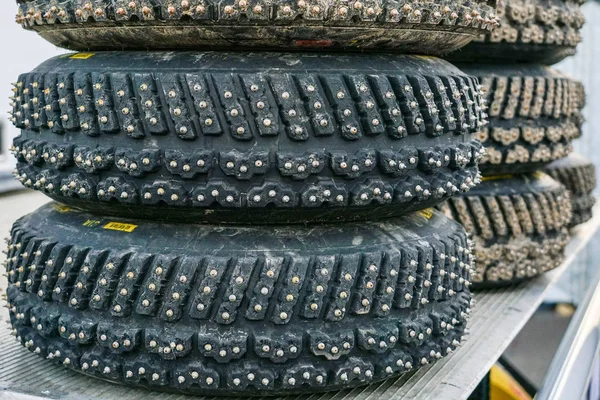 Group of studded snow tires for rally for use in winter rally stages — Stock Photo, Image