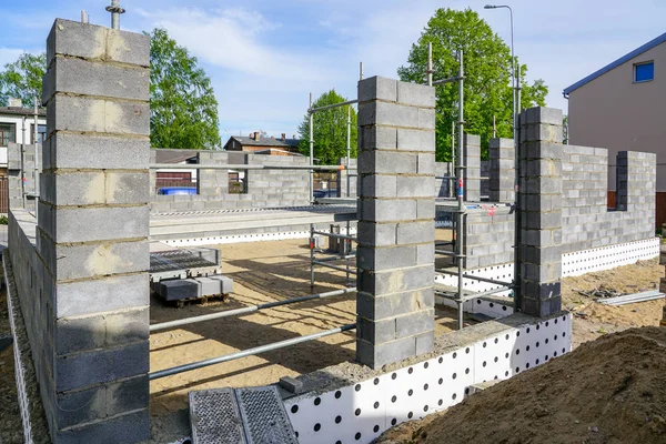 Concrete foundation of a new house, view of construction site in preparation process