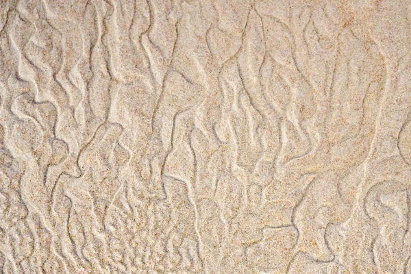 Результат гри вітру і води з піском на березі моря — стокове фото