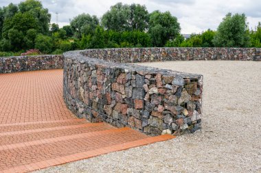 a modern urban park environmental object, gabion fence wall from steel mesh with stones clipart