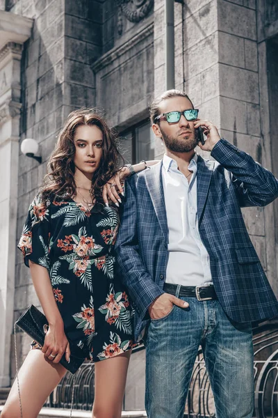 Portrait of a beautiful young people walking in the city. Summer fashion.