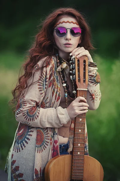 Beautiful hippie girl posing outdoor. Contemporary bohemian style. Spirit of freedom. Fashion shot. Bohemian, bo-ho style.