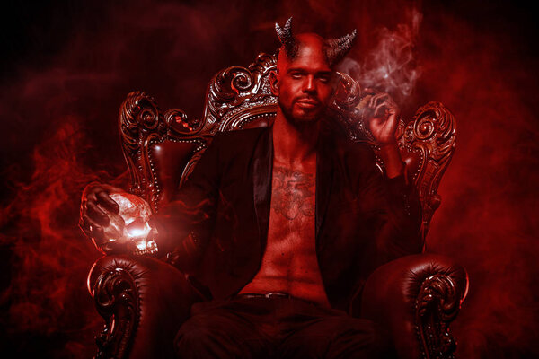 A portrait of a bad demon in his throne. Horror movie, nightmare. Halloween.