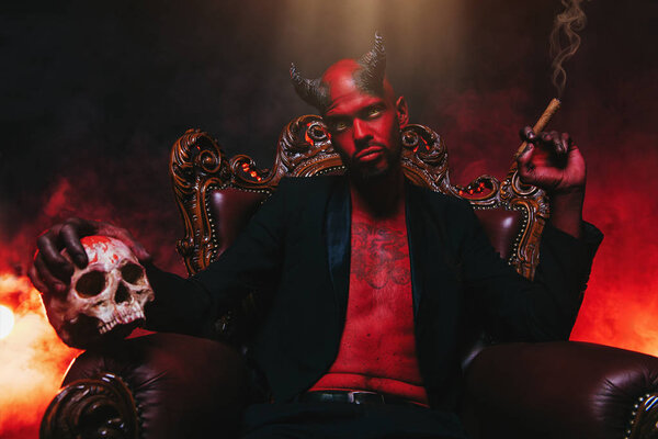 A portrait of a bad demon in his throne. Horror movie, nightmare. Halloween.