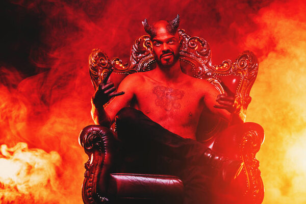 A portrait of a bad demon in his throne. Horror movie, nightmare. Halloween.