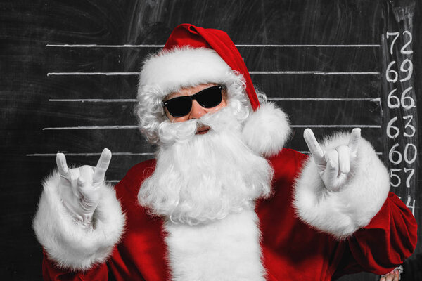 A portrait of cool Santa Claus in sunglasses. Merry Christmas and Happy New Year!