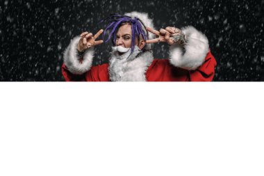 Portrait of a cool punk Santa Claus with bright dreadlocks over black background. clipart
